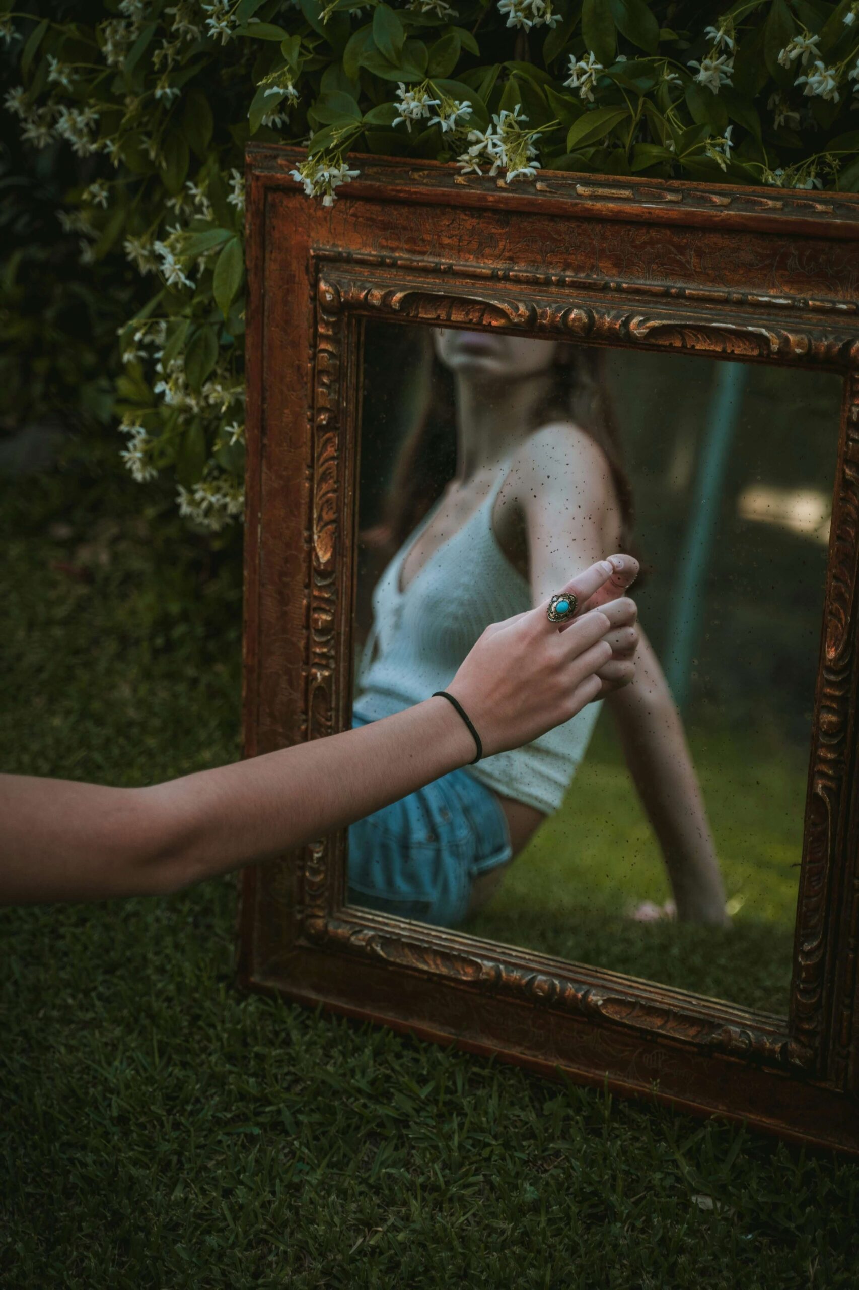 staring in mirror speaking positive affirmations